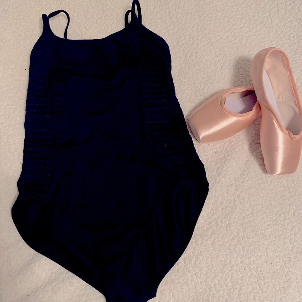 Strapped black leo with stripped mesh on the sides